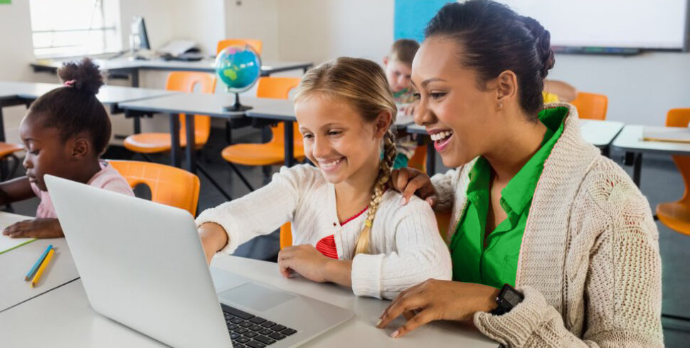 Teacher happily using AI teacher assistant to help student with an essay